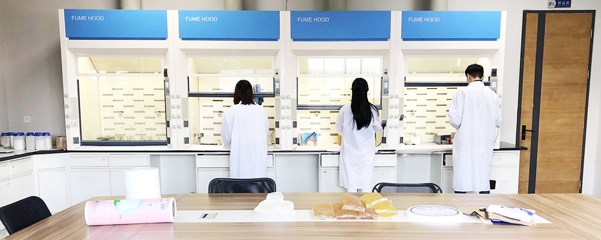 Laboratory staff working at testing benches